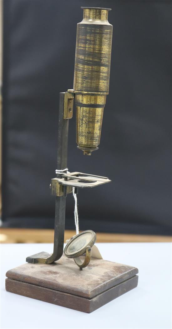 A 19th century folding sun dial and a compound microscope